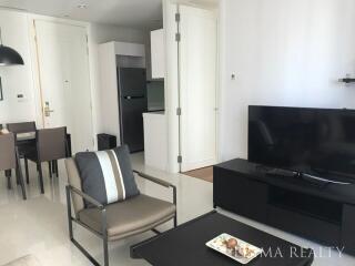 Modern living room with integrated dining area and open kitchen