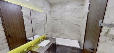 Modern bathroom with marble walls and LED lighting