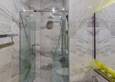 Modern Bathroom with Glass Shower and Marble Walls