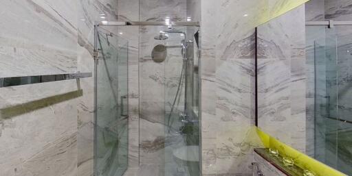 Modern Bathroom with Glass Shower and Marble Walls