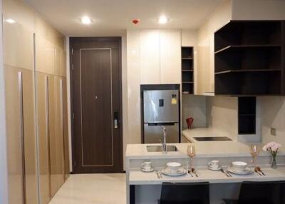 Modern kitchen with integrated dining area and ample storage space