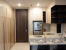 Modern kitchen with integrated dining area and ample storage space