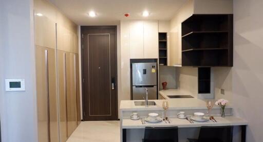 Modern kitchen with integrated dining area and ample storage space