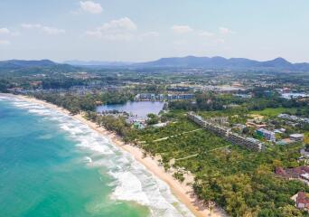 Aerial view of a coastal real estate property with beachfront access