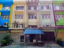 Colorful buildings with a commercial area on the ground floor