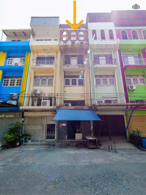 Colorful buildings with a commercial area on the ground floor