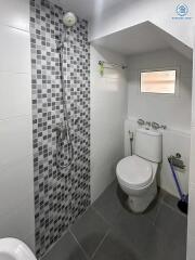 Modern bathroom interior with tiled walls and flooring