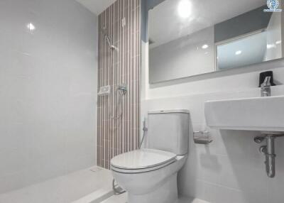Modern bathroom with white ceramic fittings and grey tiles