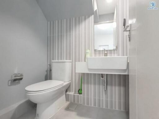 Modern white bathroom with shower and toilet