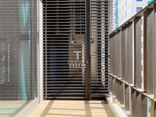 Modern balcony with wooden slats and city view