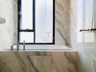 Modern bathroom with marble finish and sleek design