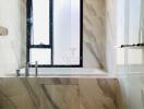 Modern bathroom with marble finish and sleek design