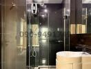 Modern bathroom interior with glass shower and elegant fixtures