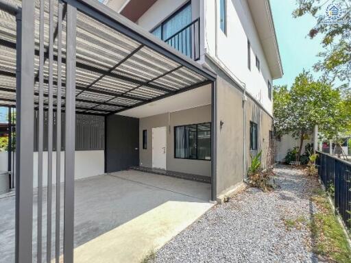 Modern residential home exterior with carport