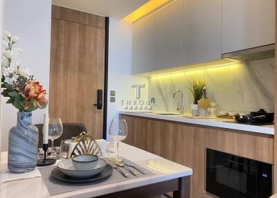 Modern kitchen with wooden cabinets and integrated appliances