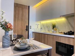 Modern kitchen with wooden cabinets and integrated appliances