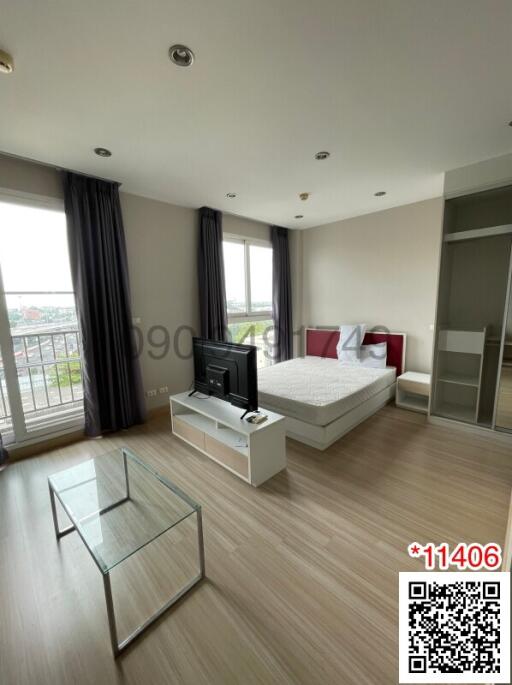 Spacious furnished bedroom with ample natural light and modern amenities