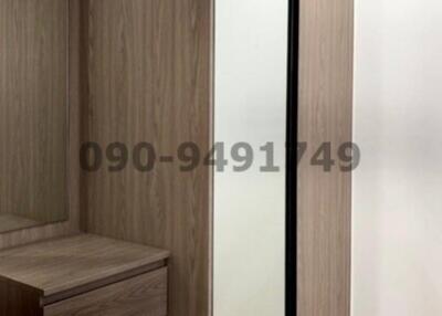 Modern bedroom with wooden wardrobe and sliding doors