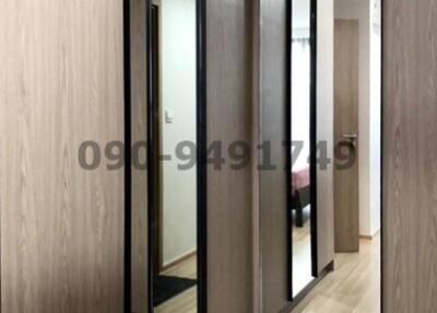 Modern corridor with mirrored sliding closet doors