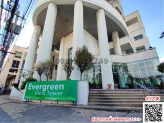 Exterior view of Evergreen View Tower with prominent columns and signage