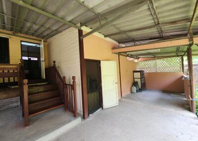Spacious undercover garage area with access to the house