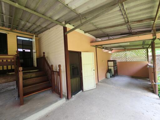 Spacious undercover garage area with access to the house