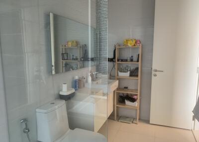 Modern bathroom with glass shower division and white interior