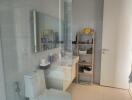 Modern bathroom with glass shower division and white interior