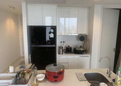 Modern kitchen with white cabinets and stainless steel appliances