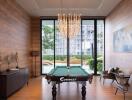 Elegant living room with billiard table, modern furniture, and striking chandelier