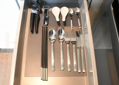 neatly organized kitchen drawer with various utensils