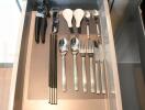 neatly organized kitchen drawer with various utensils