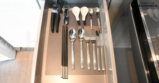 neatly organized kitchen drawer with various utensils