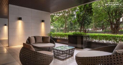 Elegant outdoor lounge area with comfortable seating and ambient lighting