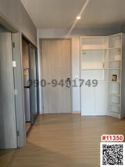 Modern interior hallway with wooden flooring and built-in storage