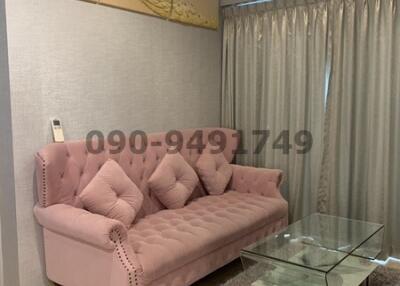 Cozy Living Room Interior with Plush Pink Sofa and Elegant Decor