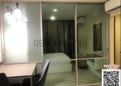 Modern bedroom with glass sliding doors and ambient lighting