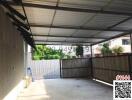 Spacious garage with a metal roof and cement flooring