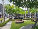 Well-maintained outdoor communal space with benches and greenery