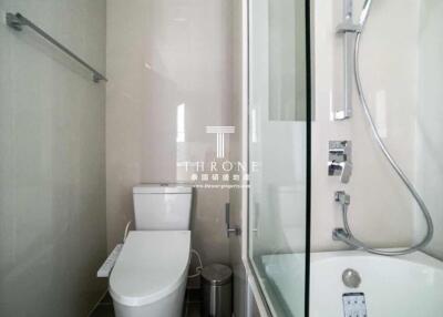 Modern bathroom interior with glass shower and toilet facilities