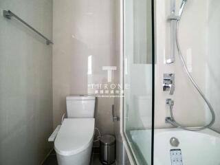 Modern bathroom interior with glass shower and toilet facilities