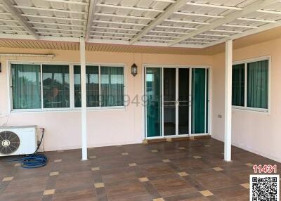 Spacious covered patio with tiled flooring