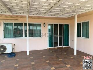 Spacious covered patio with tiled flooring