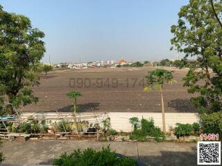 Wide view of an open land area from a property showing potential for development or a scenic view