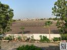 Wide view of an open land area from a property showing potential for development or a scenic view