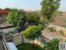 Spacious balcony with a view of the surrounding area and greenery