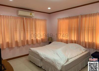 Cozy bedroom with air conditioning and ample natural light