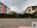 Exterior view of apartment buildings with cloudy sky