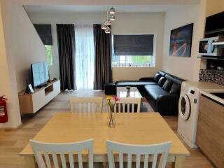 Spacious living room with dining area and modern appliances