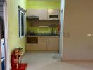 Compact kitchen space with modern appliances and bright lighting